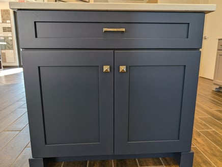 Navy blue, full-overlay framed cabinet